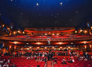 Inside the Akron Civic Theatre with illuminated seats and a starry ceiling display.