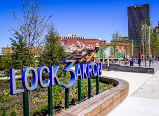 Lock 3 Akron sign in front of the park on a sunny day.