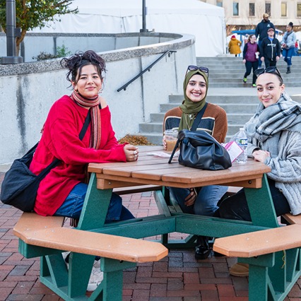 2024 Smells Like Snow2-214-cropped A woman sitting and relaxing with a dog at Lock 4