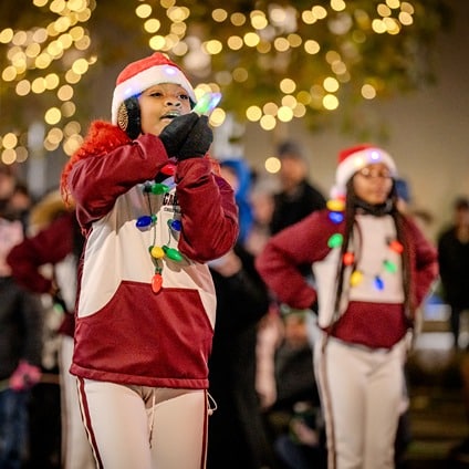2024_Lock3_GrandReopening_A7IV_0546-cropped A man and women clink coffee cups